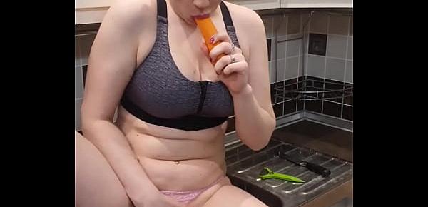  Horny Housewife Passionately Fingering Pussy With Carrots in the Kitchen